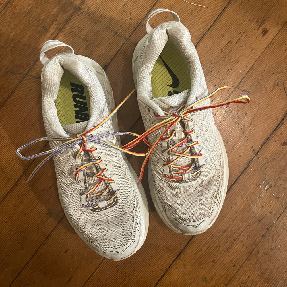 White HOKAs with rainbow laces